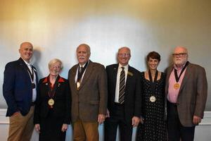 (L to R) Rob Markin, Betsy Markin, Darrin Good, Roger Cognard, Anne Cognard and Jonathan Redding receive medallions.